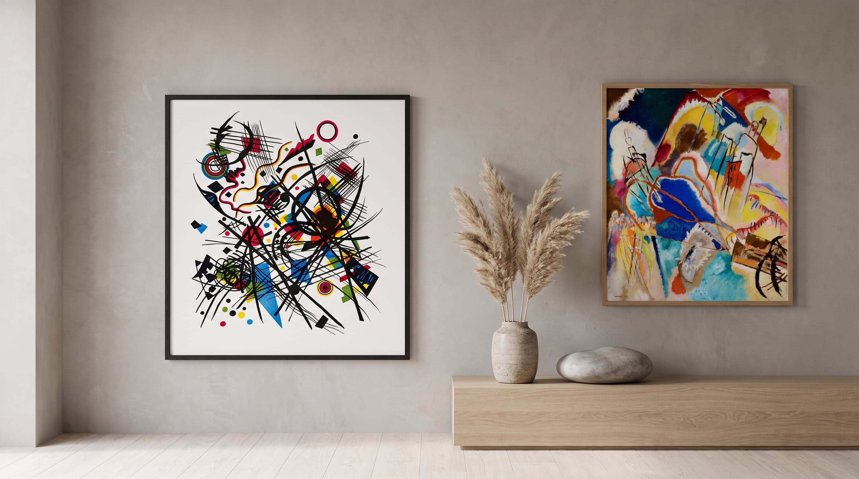 Minimalist wall featuring a Bauhaus lithograph and geometric print in a warm, pared-back interior.