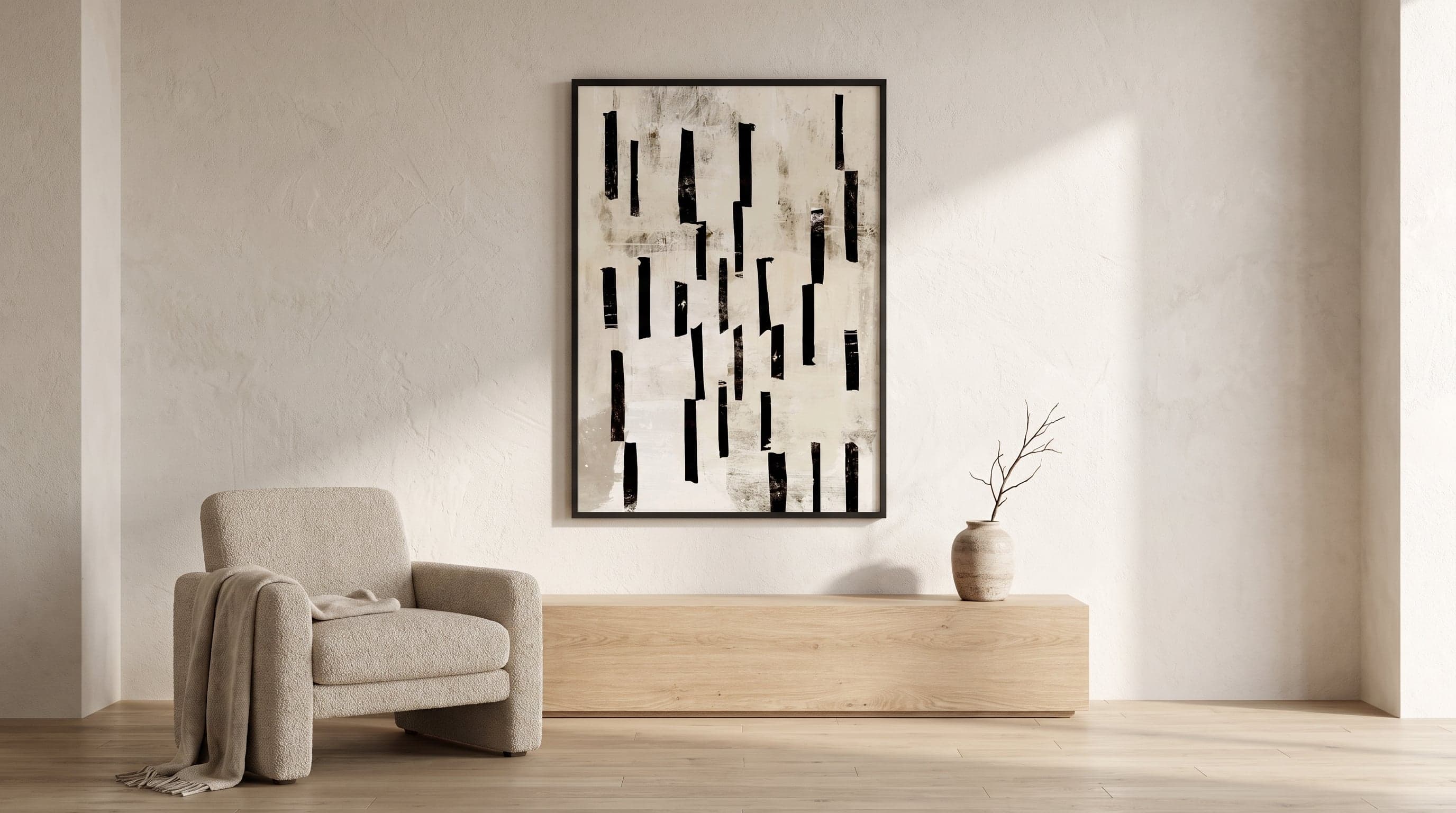 Minimalistiskt vardagsrum med ett enda stort grafiskt konsttryck som blickfång på väggen.